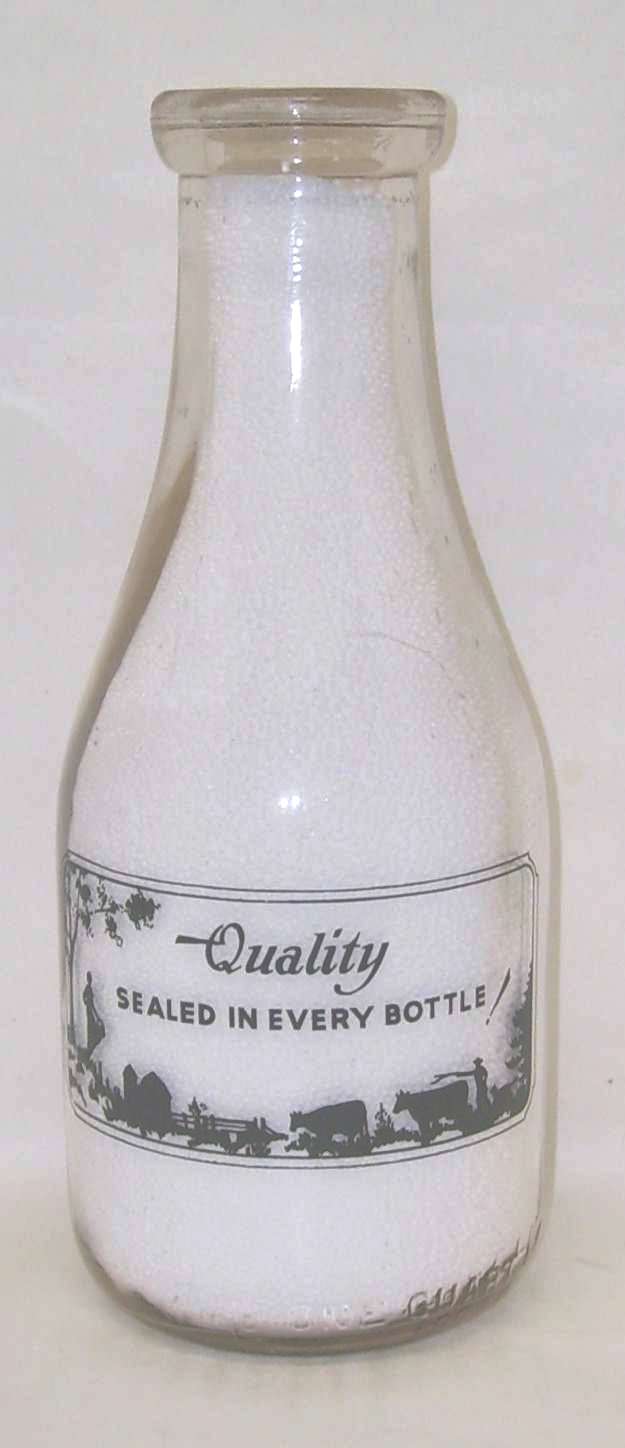 S497    Finnegan's  Dairy  Qt  milk bottle